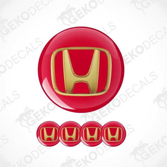 three-dimensional gold Honda emblem on a red background