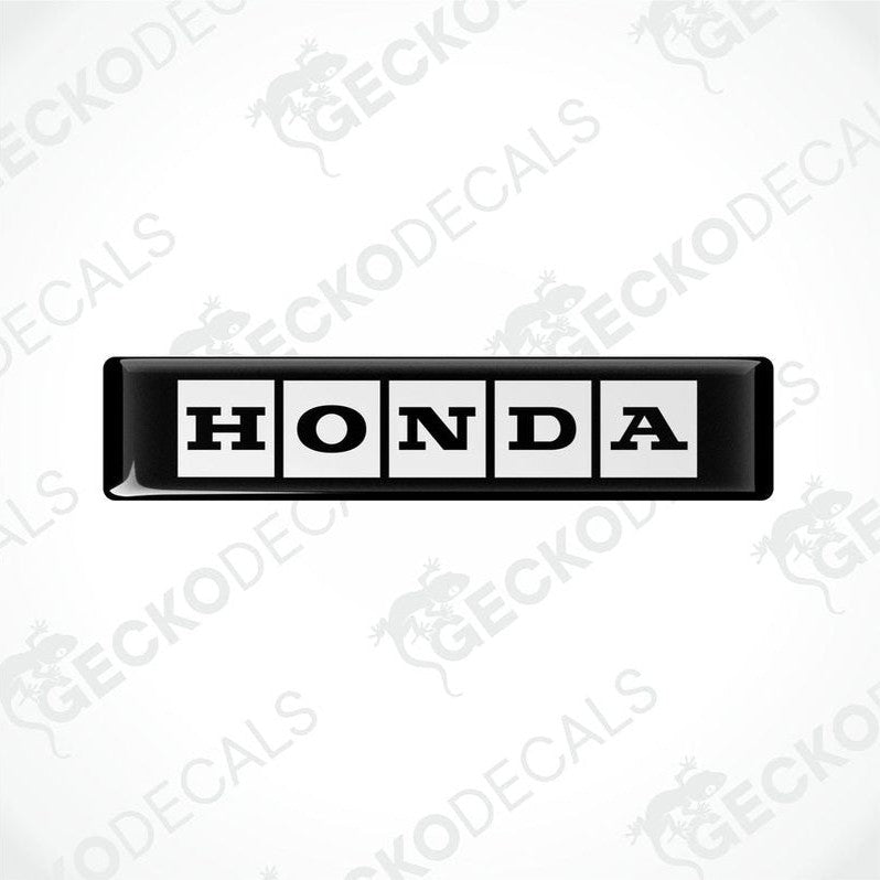  Rectangular black and white vinyl decals with the text 'HONDA' displayed on them.