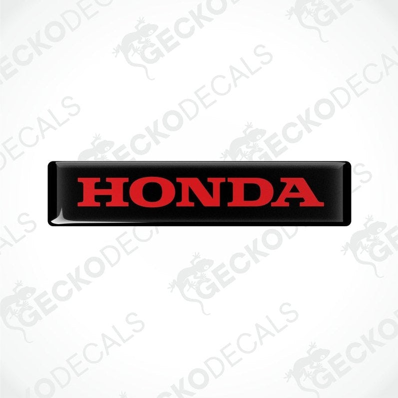 Rectangular black vinyl decals with the word 'HONDA' written in bold red letters.