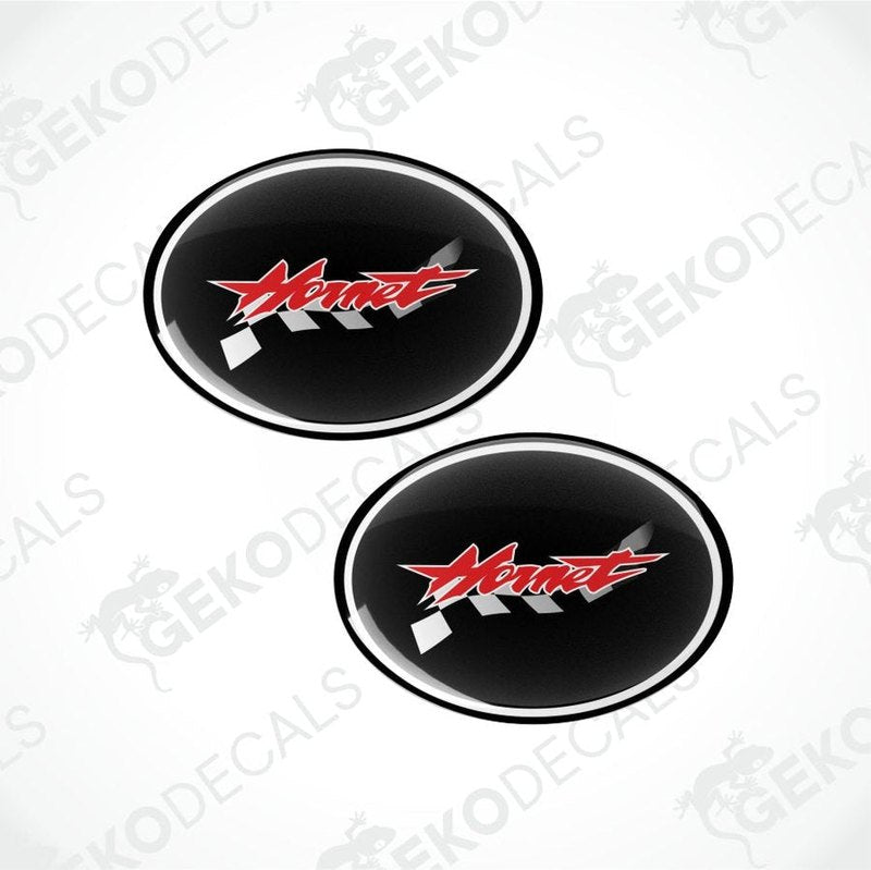 Two black oval decals with a red logo on a white background.