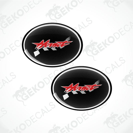 Two black oval decals with a red logo on a white background.