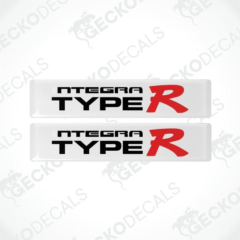 Two white vinyl stickers with the text 'INTEGRA TYPE R' in red and black.