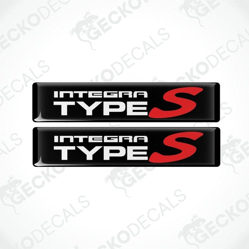 Two black vinyl stickers with the text 'INTEGRA Type S' in red and white.