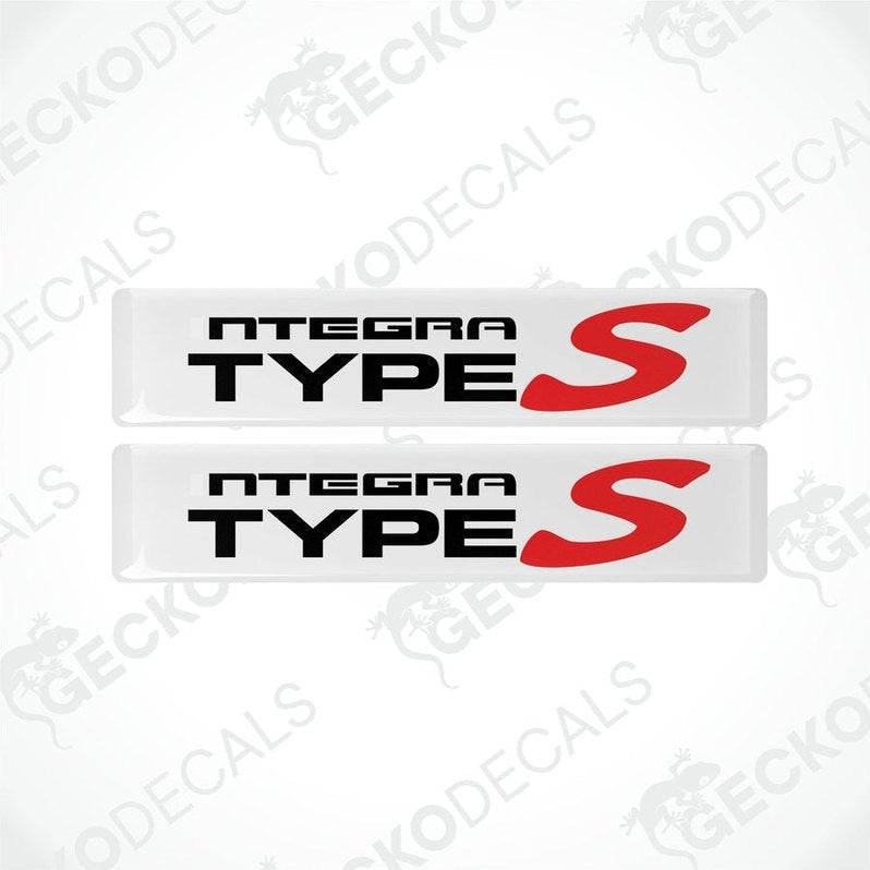 Two white vinyl stickers with the text 'INTEGRA Type S' in red and black.