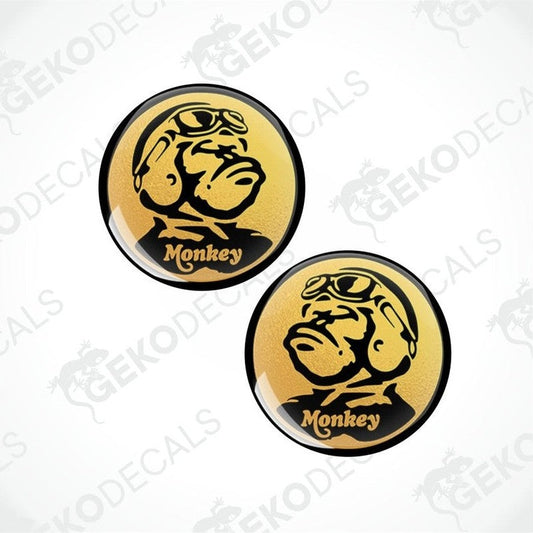 Two round stickers with a monkey design and 'Monkey' text on a white background.