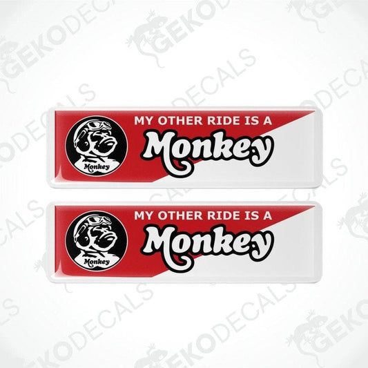 Two red and white decals with 'My Other Ride is a Monkey' text and logo on a white background.