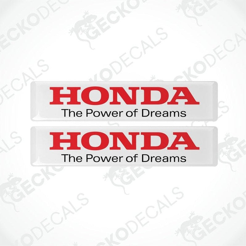 Two rectangular white vinyl decals with red text that reads 'HONDA The Power of Dreams'