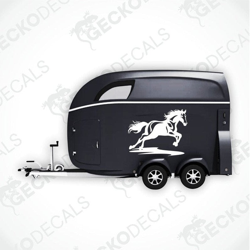 Black galloping horse decal on black trailer side panel