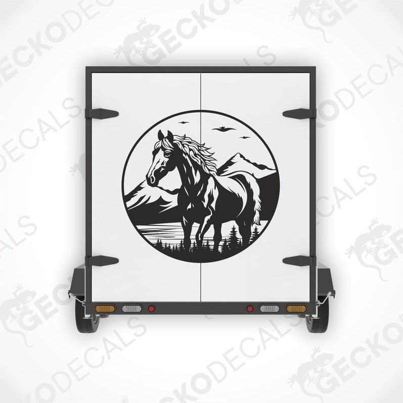 A black and white decal of a horse with a mountainous background.