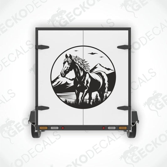 A black and white decal of a horse with a mountainous background.