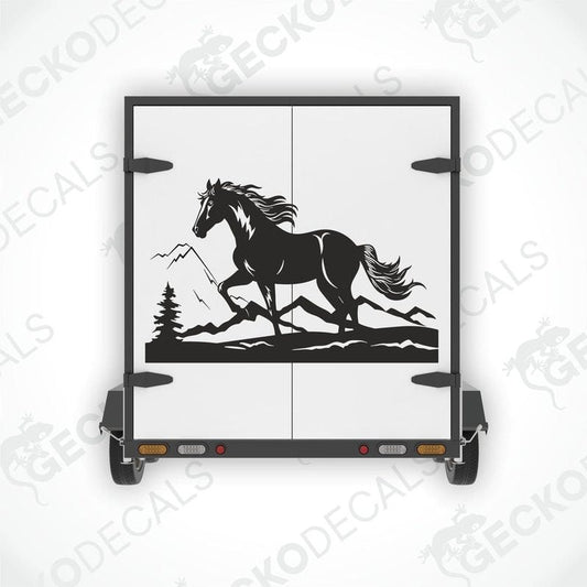 A black and white die cut decal of a horse in a mountainous landscape, displayed on a vehicle.