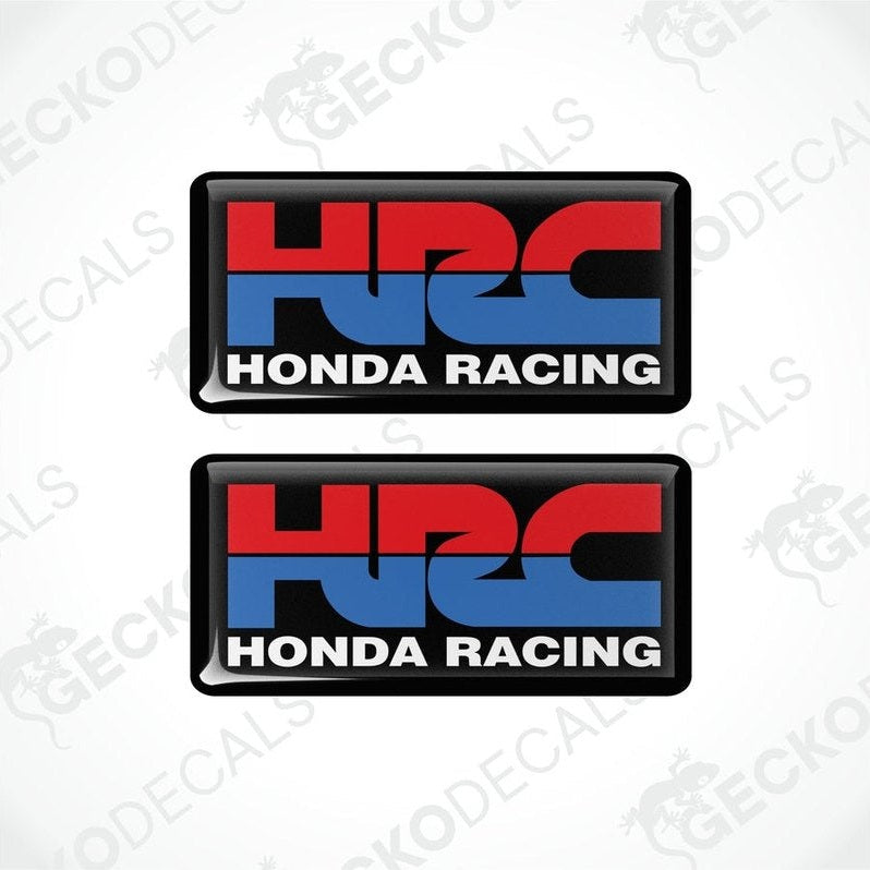 Two square vinyl stickers with a red, blue, and white design featuring the text 'HONDA RACING' and the Honda logo.