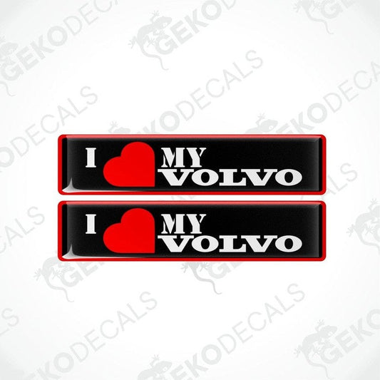 Two red, black, and white vinyl decals with the text 'I heart MY VOLVO' on them, displayed on a white background.