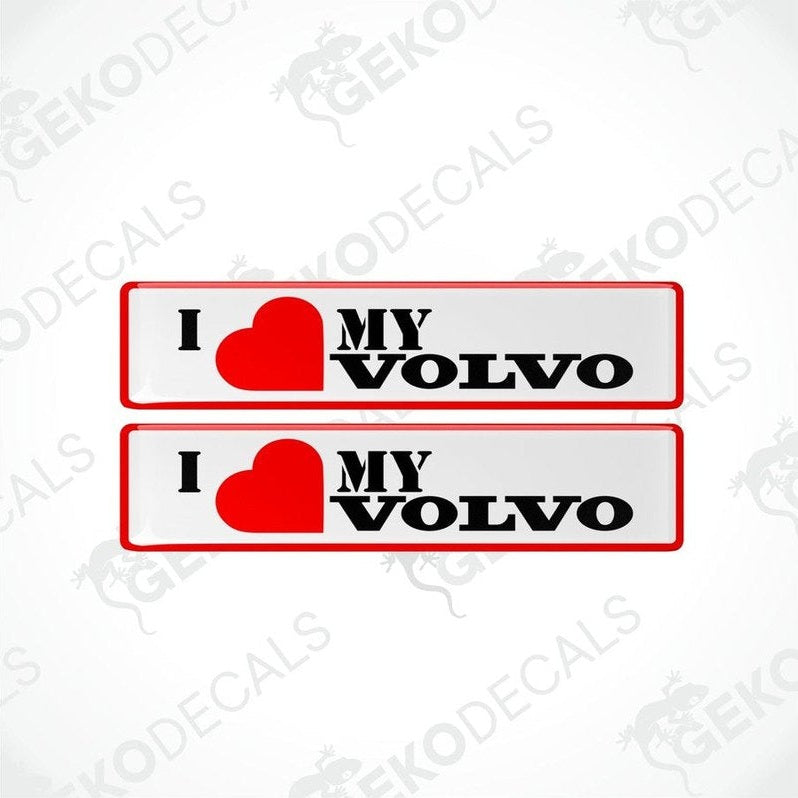 Two red, black, and white vinyl decals with the text 'I heart MY VOLVO' on them, displayed on a white background.