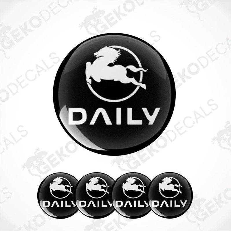 A set of black vinyl decals with the IVECO DAILY logo, including one large decal and four smaller dome-shaped stickers.