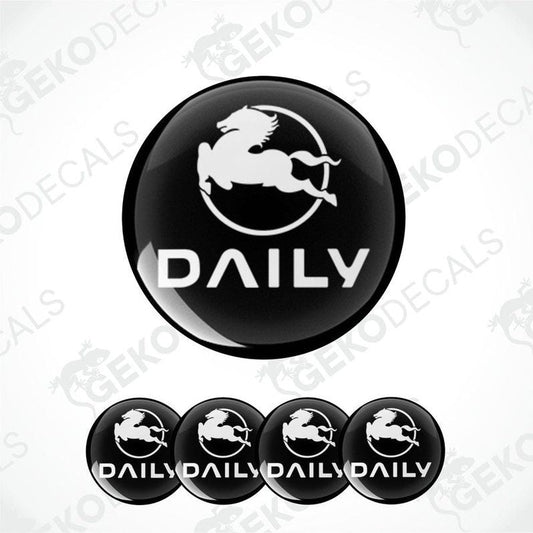 A set of black vinyl decals with the IVECO DAILY logo, including one large decal and four smaller dome-shaped stickers.