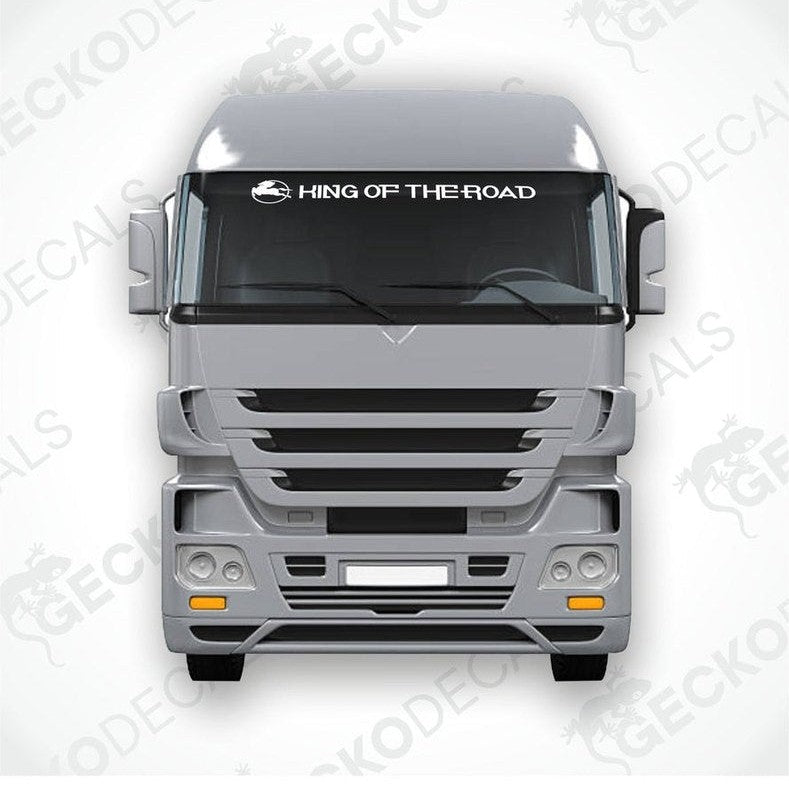 A front view of an IVECO truck with a windscreen decal reading 'KING OF THE ROAD'.