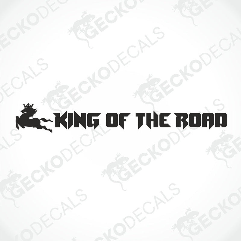A die cut decal with the text 'KING OF THE ROAD' positioned on the windscreen of a gray truck.