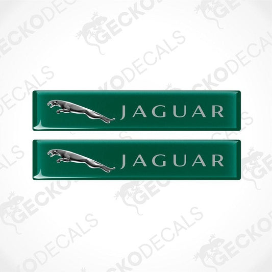 Two green rectangular car decals with the Jaguar brand logo and name written on them.