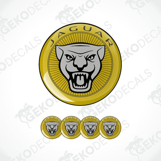 A set of four gold-colored vinyl stickers with a Jaguar logo design, displayed against a white background.
