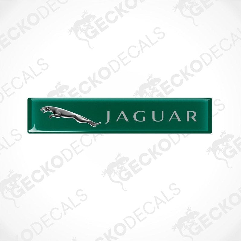 Green rectangular car decals with the Jaguar brand logo and name written on them.