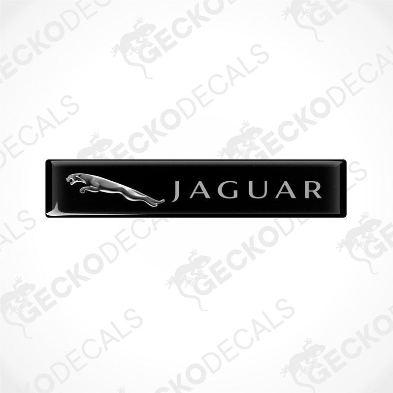  Black rectangular car decals with the Jaguar brand logo and name written on them.