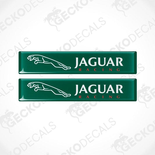 Two green rectangular car decals with the text 'JAGUAR Racing' on them.