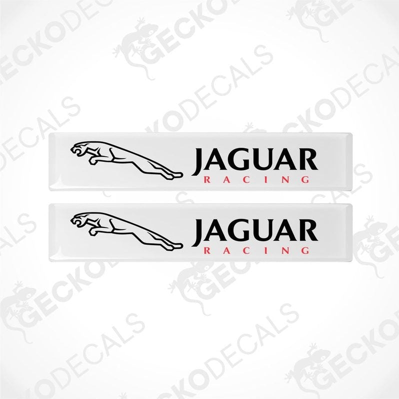 Two white rectangular car decals with the text 'JAGUAR Racing' on them.