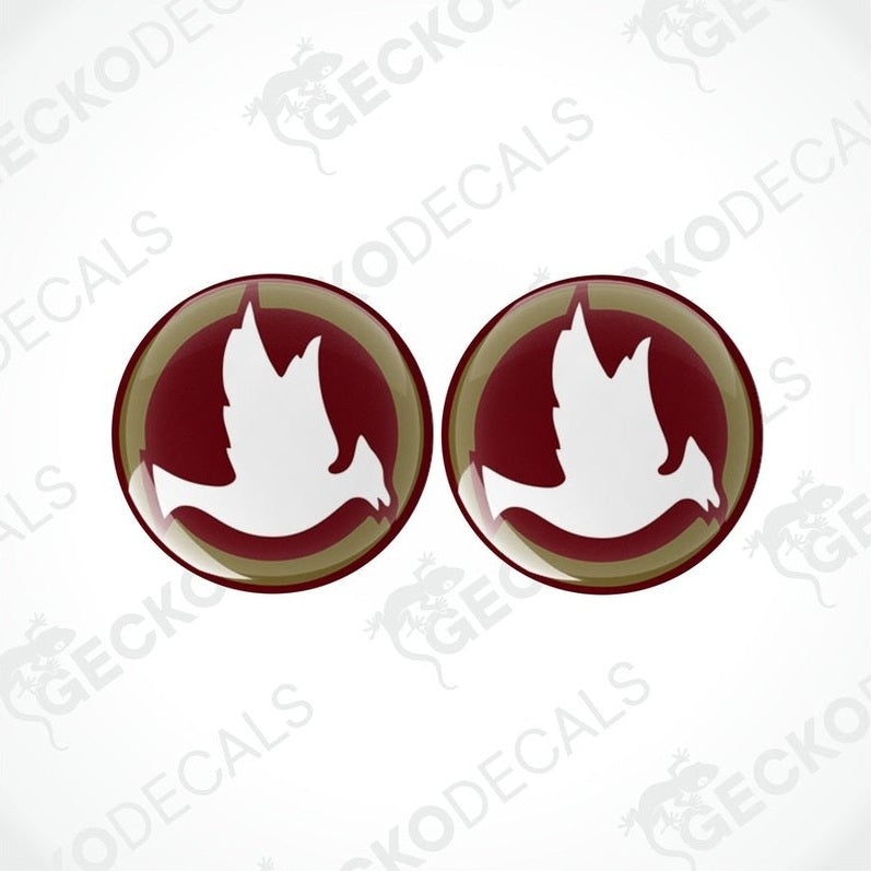 Two vehicle decals, one with a bird design and the other with a maroon and white geometric design, both with the brand name 'JAYCO' on the bottom.