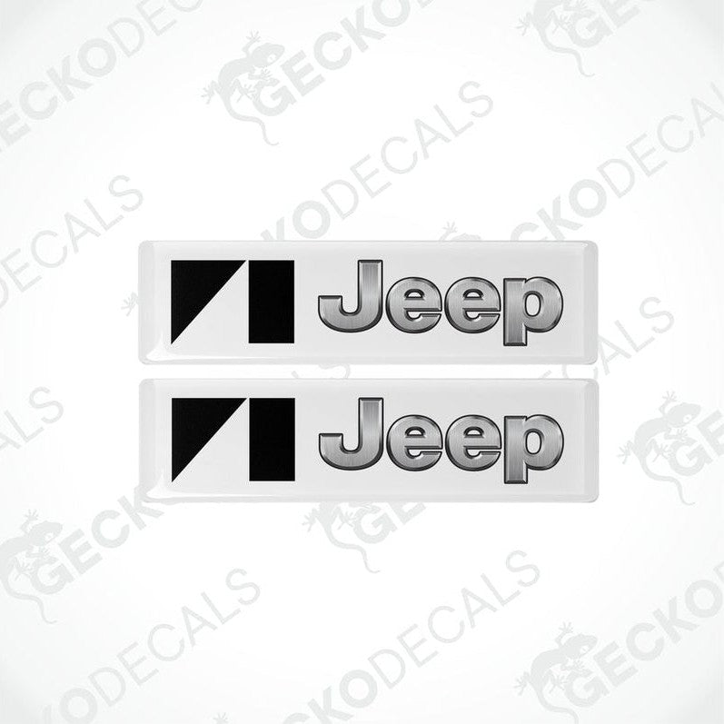 Two withe vinyl stickers with the JEEP brand logo in black.