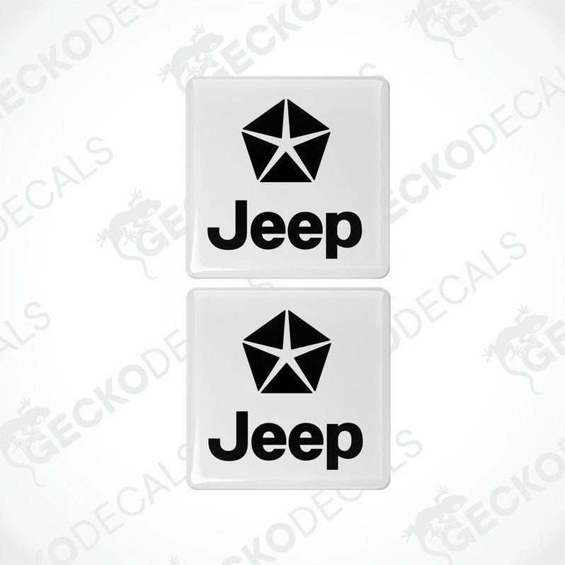 Two withe vinyl stickers with a JEEP logo on them, placed against a black background.