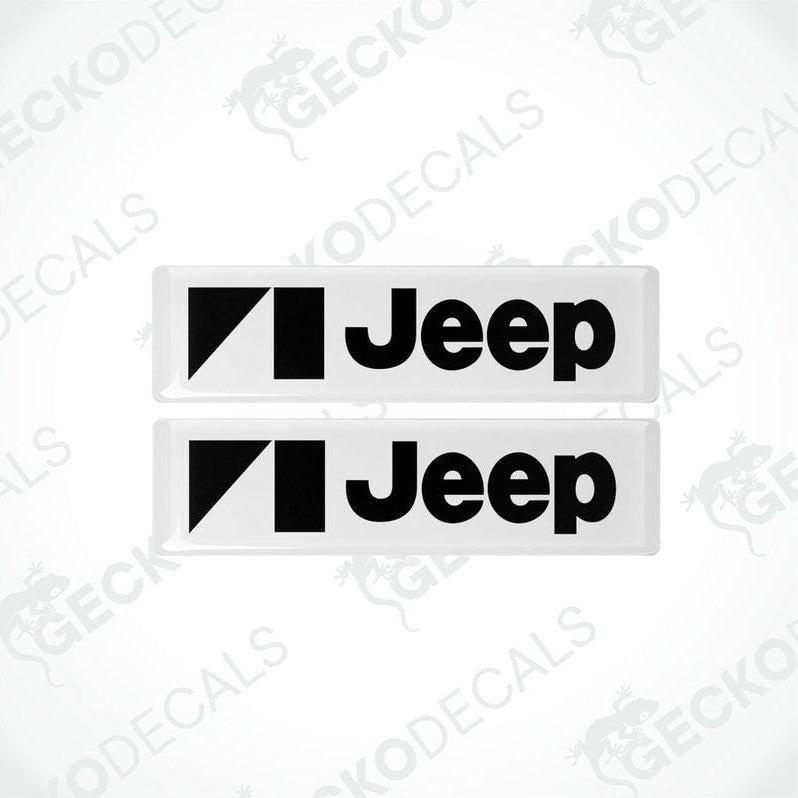 Two withe vinyl stickers with the JEEP brand logo in black.