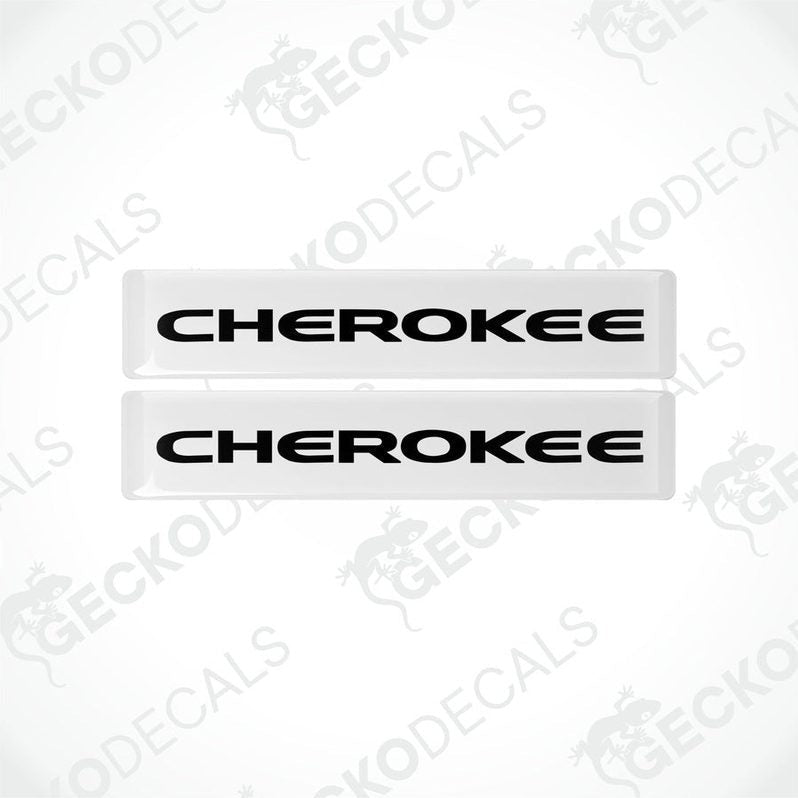 Two withe vinyl decals with the word 'CHEROKEE' written in black letters.
