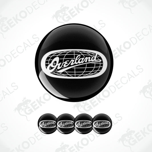 A set of four black vinyl stickers with the word 'overland' and a design that resembles a globe.