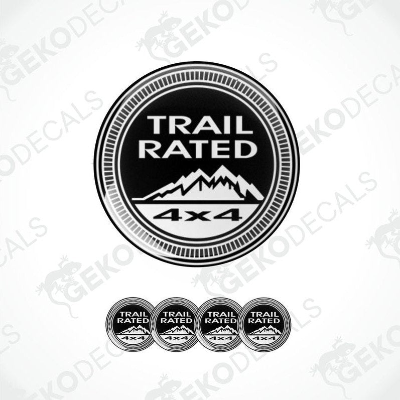 A set of four black vinyl stickers with the text 'TRAIL RATED 4X4' and a mountain range illustration in the center.