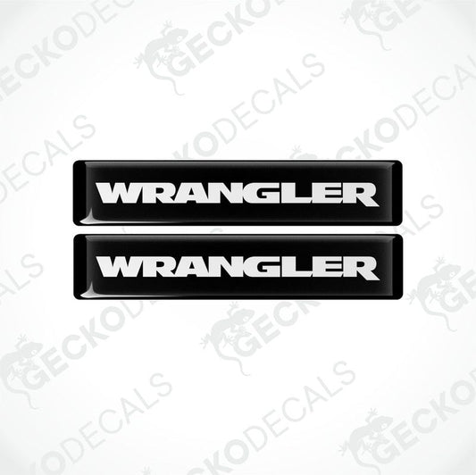 Two black and white vinyl decals with the word 'WRANGLER' printed on them.