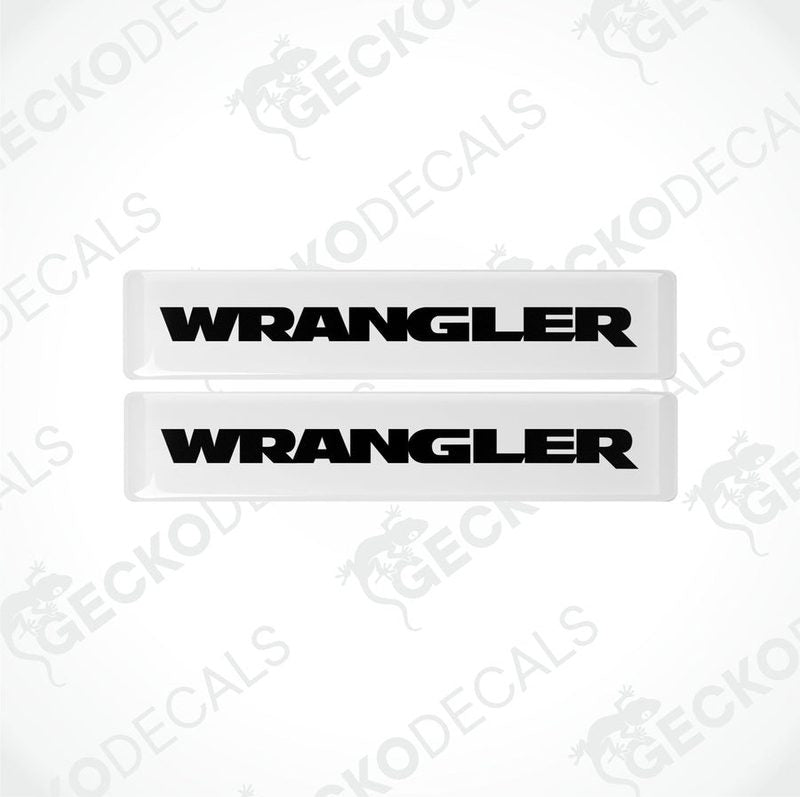 Two withe and black vinyl decals with the word 'WRANGLER' printed on them.
