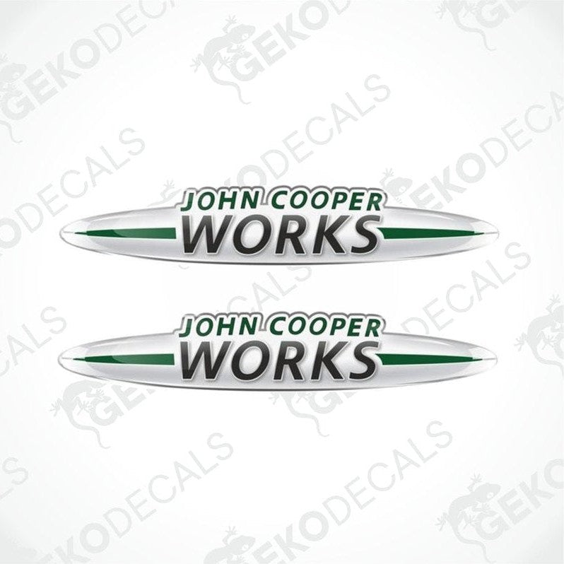 Two vinyl decals with 'John Cooper Works' text, predominantly white with green accents and a silver outline.