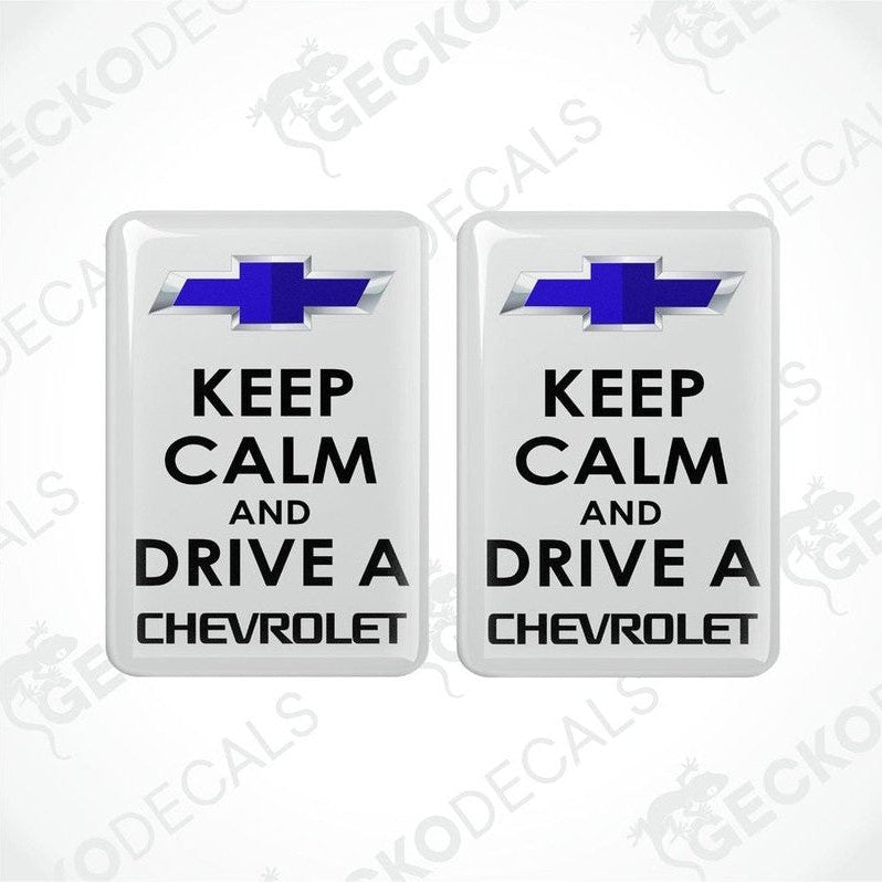 Two white vinyl stickers with the text 'KEEP CALM AND DRIVE A CHEVROLET' and the Chevrolet logo.