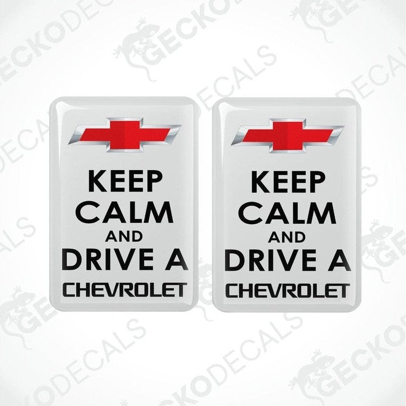 Two white vinyl stickers with the text 'KEEP CALM AND DRIVE A CHEVROLET' and the Chevrolet logo.