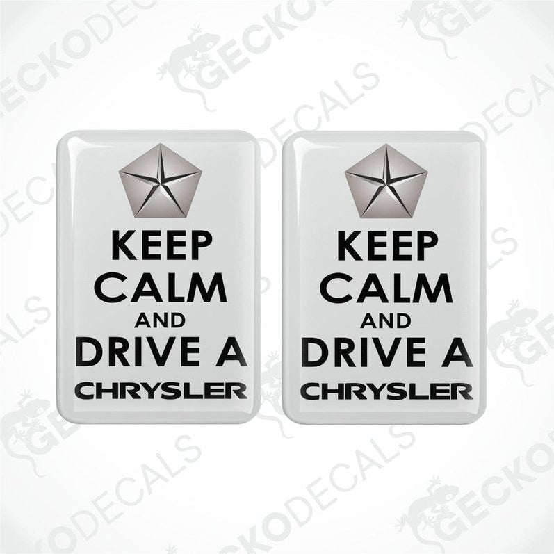 Two rectangular white vehicle decals with black text and a silver star symbol, one saying 'KEEP CALM AND DRIVE A CHRYSLER'.