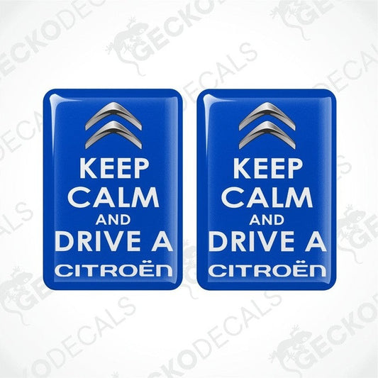 Two blue rectangular vinyl decals with the text 'KEEP CALM AND DRIVE A CITROÉN' on them.