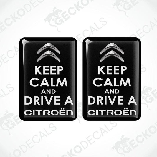 Two black vinyl stickers with the text 'KEEP CALM AND DRIVE A CITROEN' and the Citroën logo.