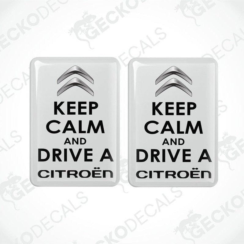 Two white vinyl stickers with the text 'KEEP CALM AND DRIVE A CITROEN' and the Citroën logo.