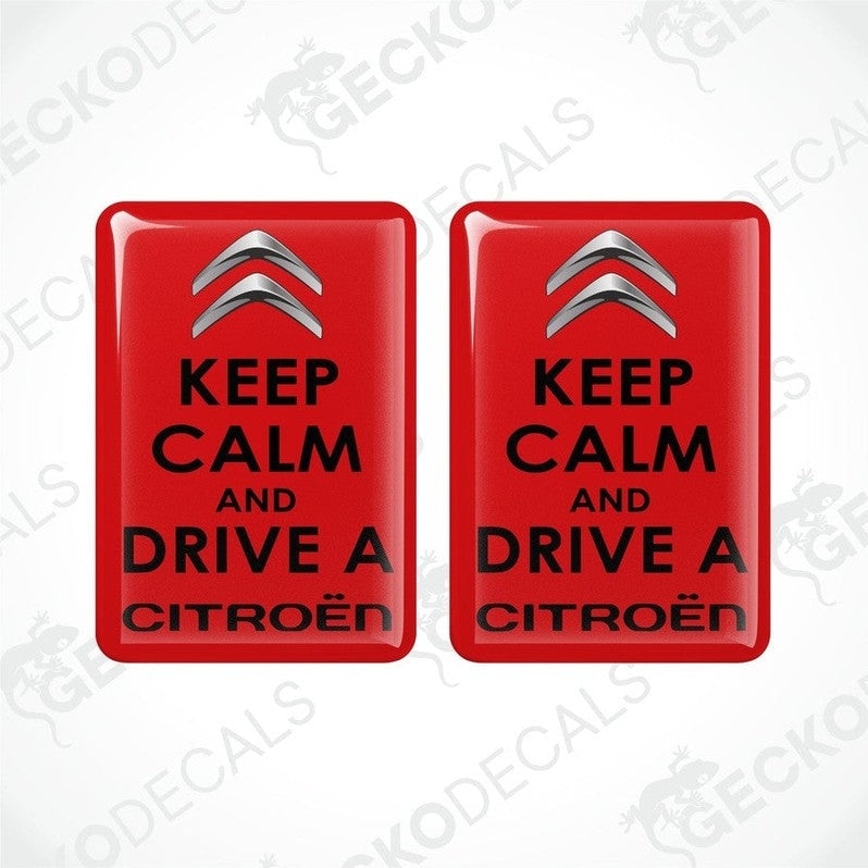 Two red rectangular vinyl decals with the text 'KEEP CALM AND DRIVE A CITROÉN' on them.