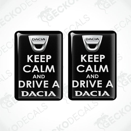 Two black vinyl decals with white text saying 'KEEP CALM AND DRIVE A DACIA'