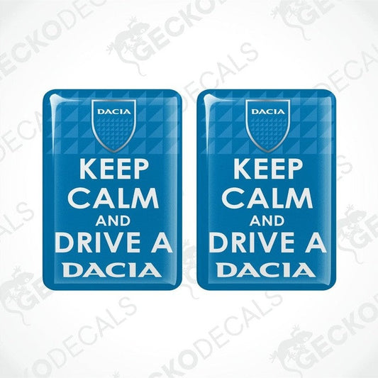 Two blue rectangular car decals with the text 'KEEP CALM AND DRIVE A DACIA' on them.