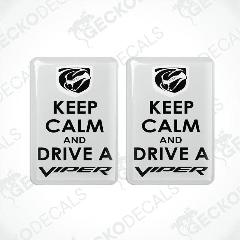 Two white vinyl stickers with the text 'KEEP CALM AND DRIVE A VIPER' and the Dodge Viper logo.
