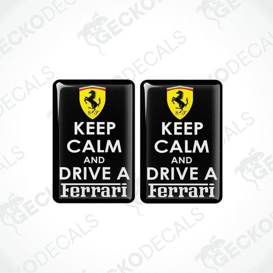 Two rectangular black vinyl decals with 'KEEP CALM AND DRIVE A FERRARI' text and the Ferrari logo in yellow.