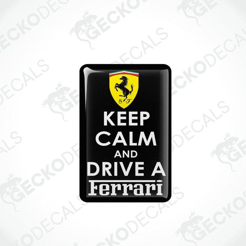 Rectangular black vinyl decals with 'KEEP CALM AND DRIVE A FERRARI' text and the Ferrari logo in yellow.